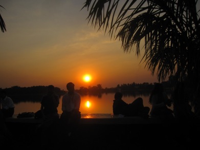 Listening to poetry at Irradaddy LIterary Festival,  as the sun setts on Inya Lake 